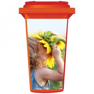 Young Girl Sniffing A Sunflower Wheelie Bin Sticker Panel